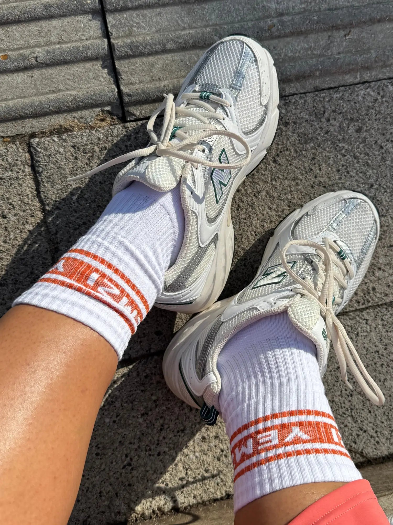 cotton crew socks worn by a lady sat outside   