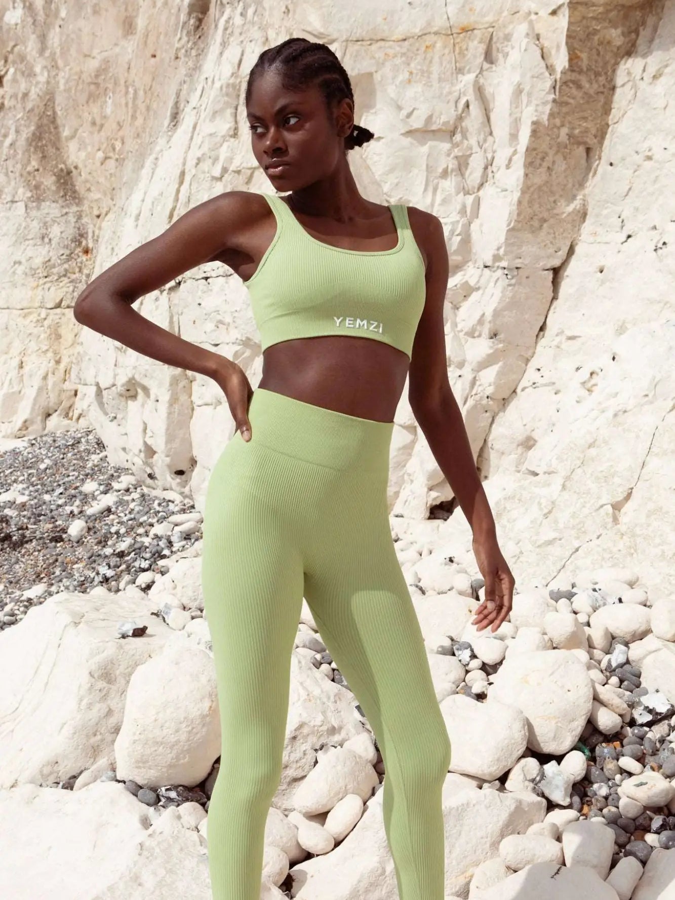 model wearing yemzi bra and leggings set outside