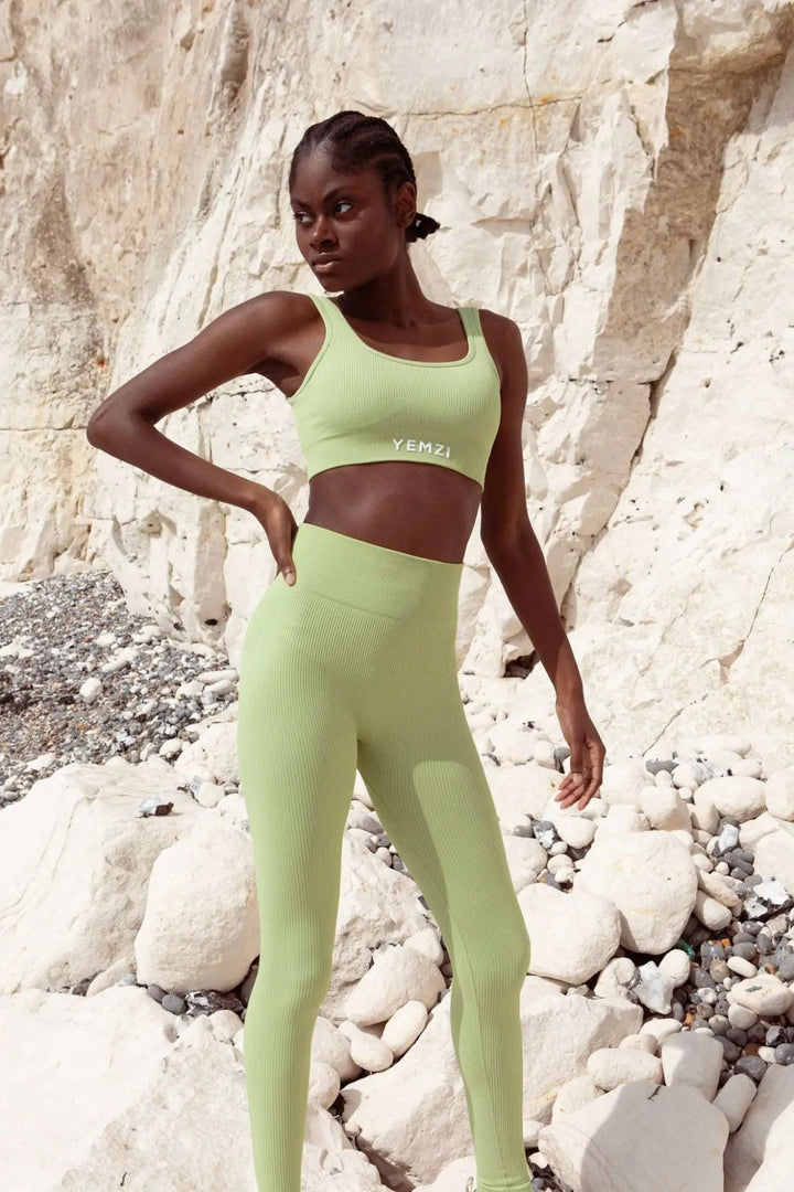 model wearing yemzi bra and leggings set outside