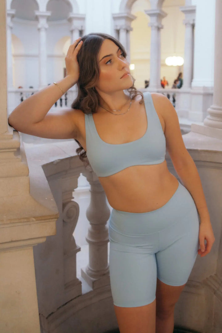 European model wearing a sky blue bra and cycle shorts    