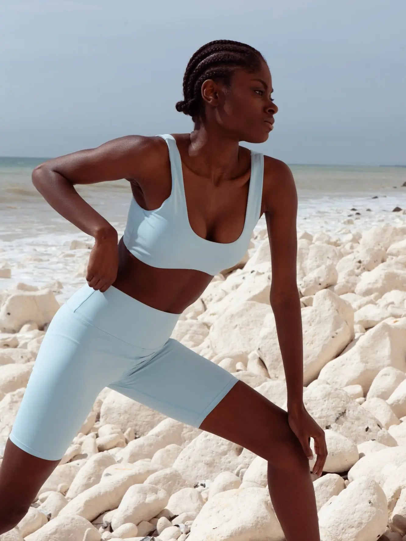 SKY BLUE BRA CYCLE SHORTS SET BACK VIEW ON MODEL OUTSIDE NEAR CLIFF