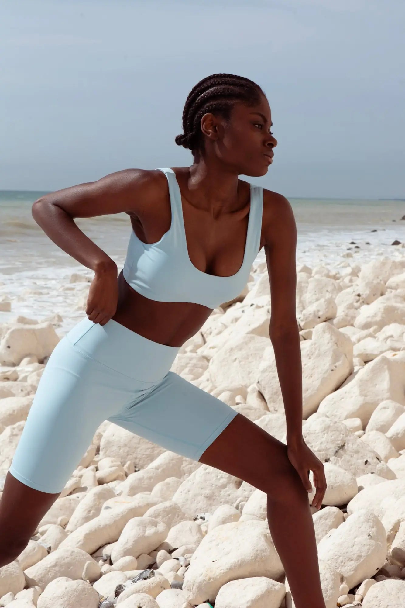 SKY BLUE BRA CYCLE SHORTS SET BACK VIEW ON MODEL OUTSIDE NEAR CLIFF