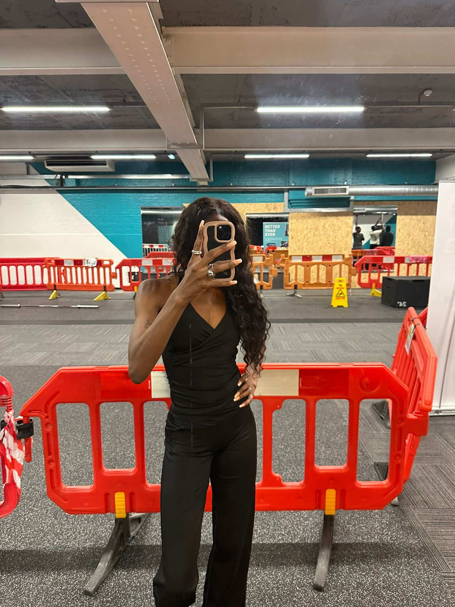 Yem wearing a black activewear set tall collection 
