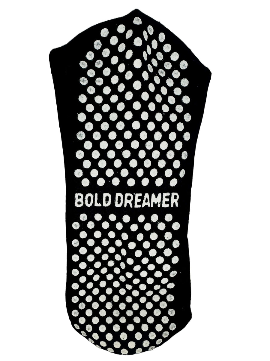 A quality pair of Yemzi black and white grip socks perfect for Pilates workout session
