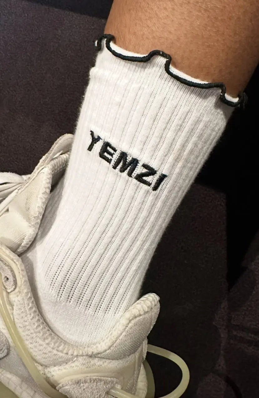 White from socks with black Yemzi embroidered logo and lettuce edge