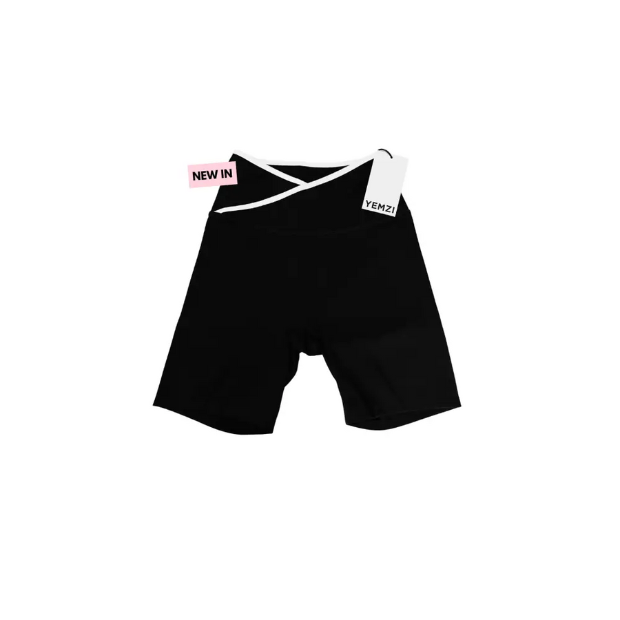 Black shorts with a tag on a white background