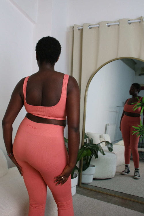 African Model in Guava pink ribbed bra and leggings
