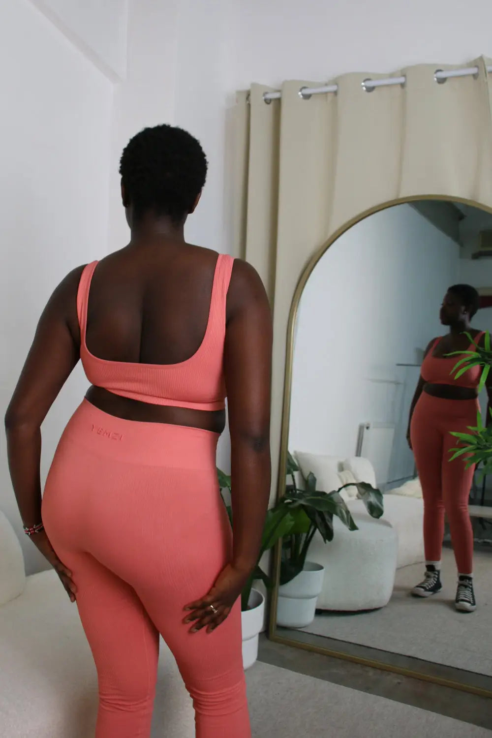 African Model in Guava pink ribbed bra and leggings