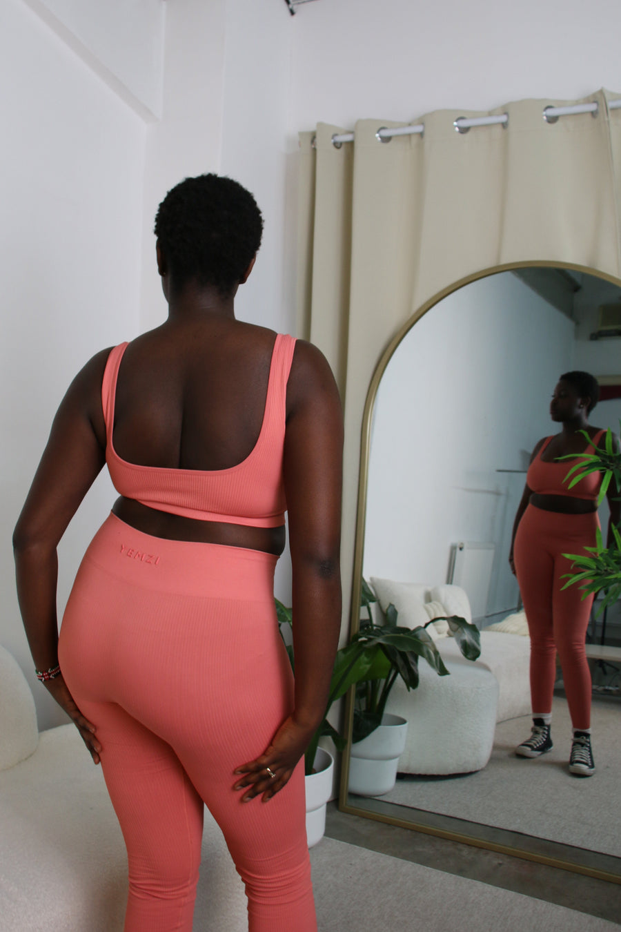 African Model in Guava pink ribbed bra and leggings