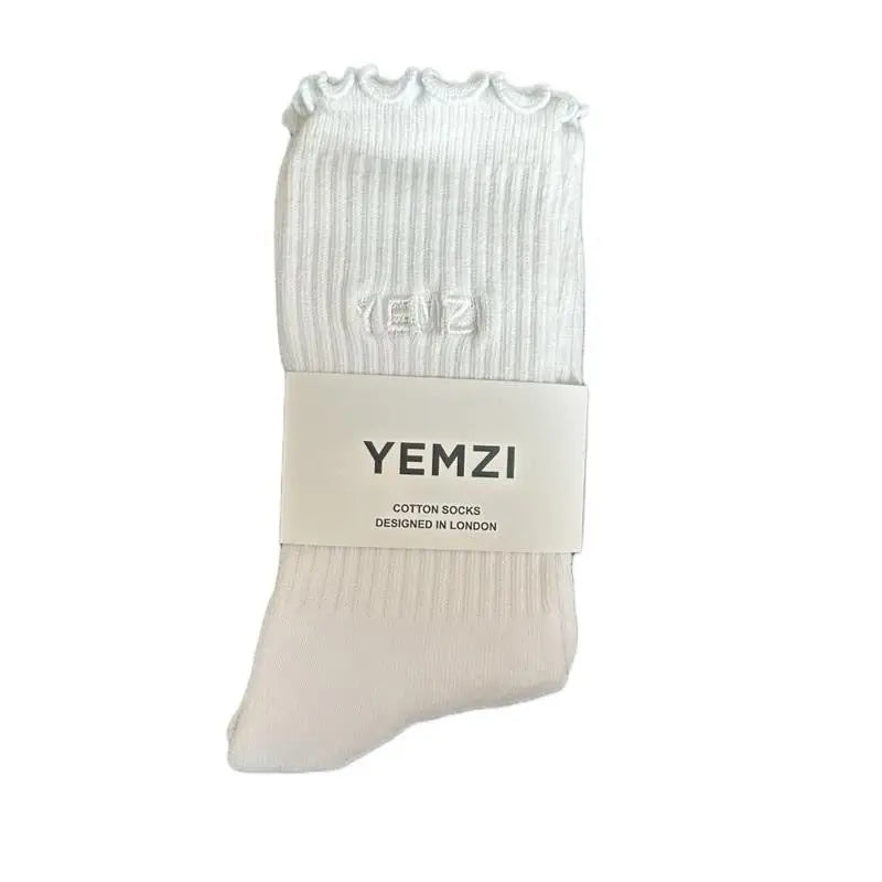 A pair of white cotton socks with embroidered brand logo