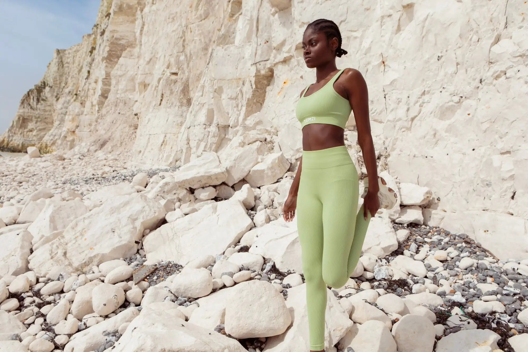 Model Rose wears Yemzi two piece set in front of the cliffs