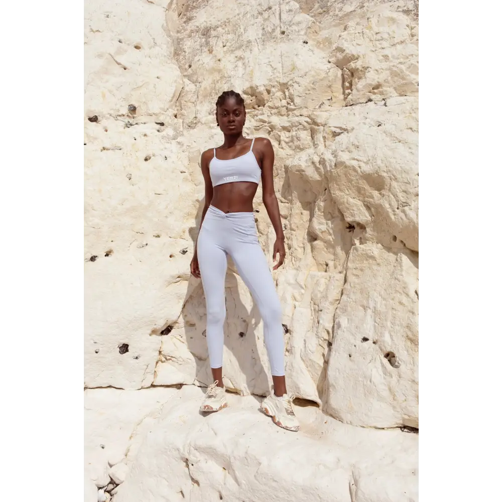 Model wearing Yemzi  Lilac two piece set pearl activewear set in rocky outdoor location