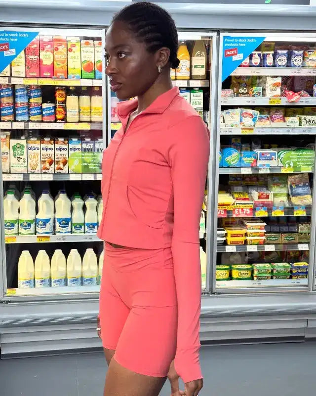 yem akingbade wearing guava ctivewear standing in front of fridge